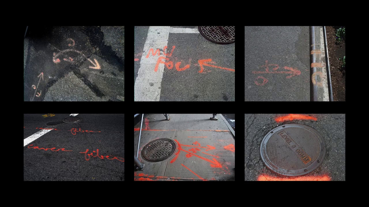 Spray-painted markings indicating utility locations