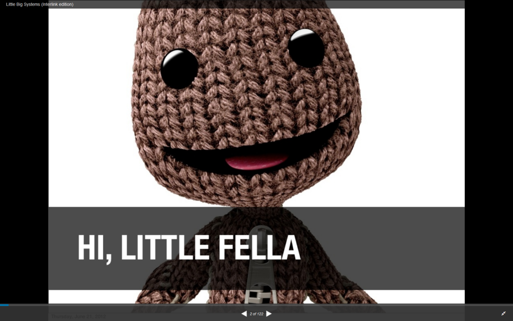 Photo of a small brown knitted figure, captioned, "Hi, little fella"