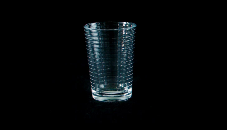A juice glass, with ridges up its sides