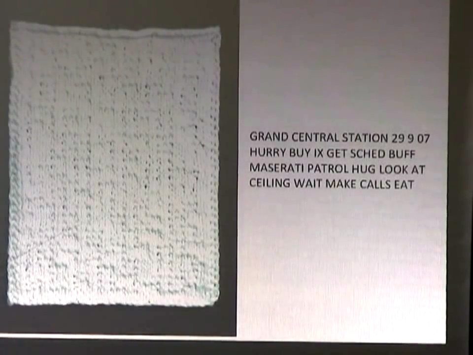 Photo of a small piece of Kristen's knitting, with translation of the encoded text beside