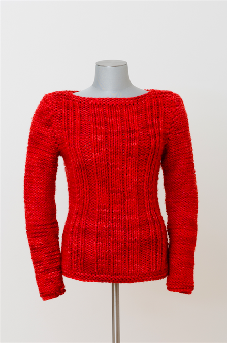 A red knit sweater with a pronounced linear pattern down the front