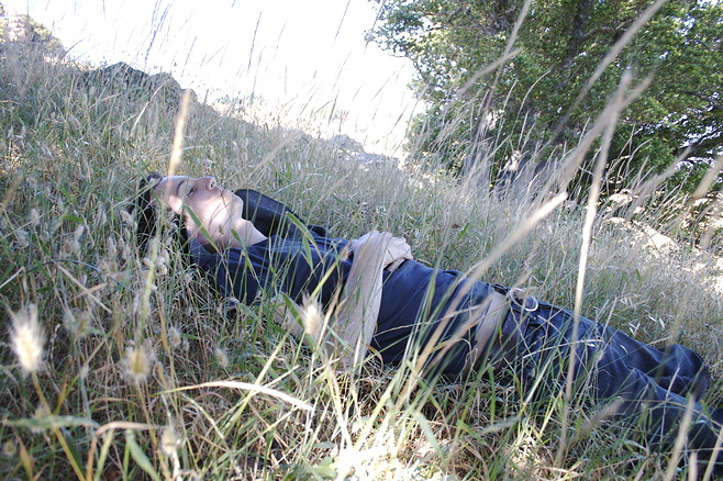 A younger Wilson Miner laying in the grass
