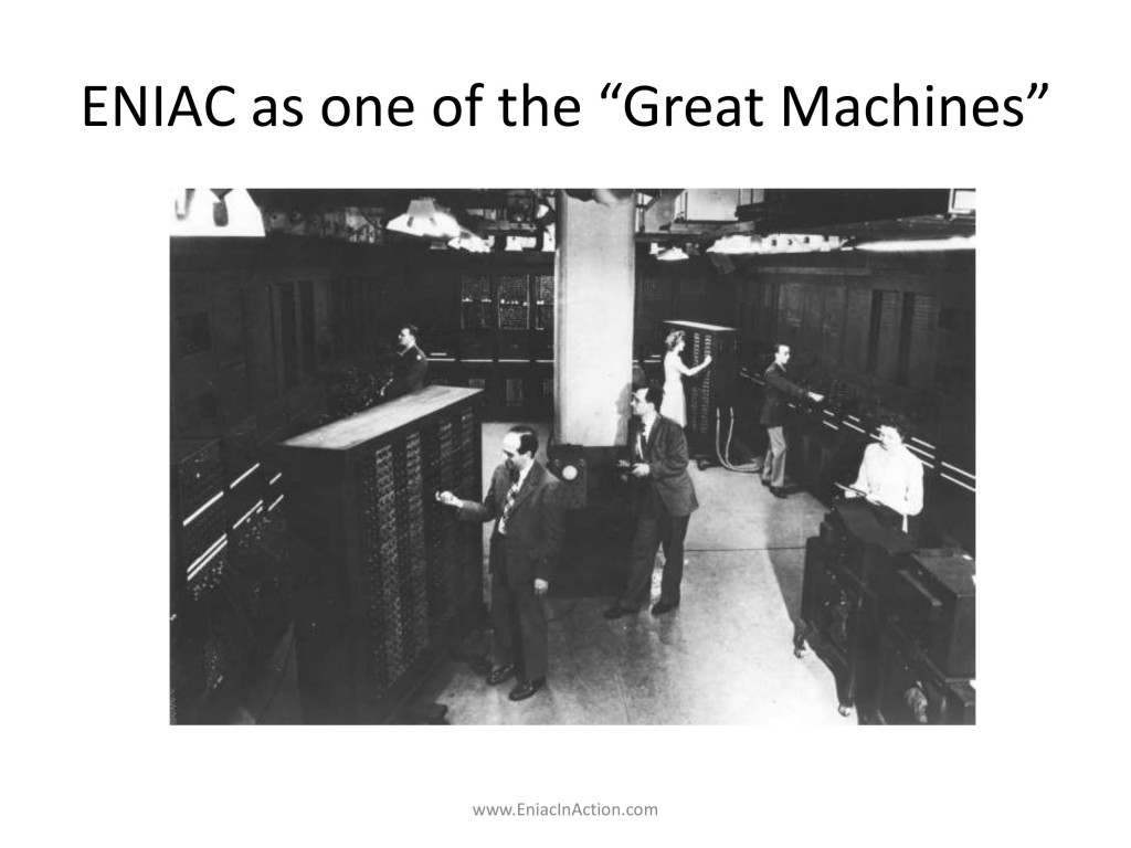 Several men and women working inside the room-like ENIAC machine
