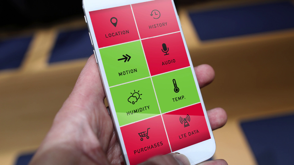 Mockup of a phone application screen showing tiles for various kinds of sensors(motion, temperature, location, etc), each colored either green or red to indicate status