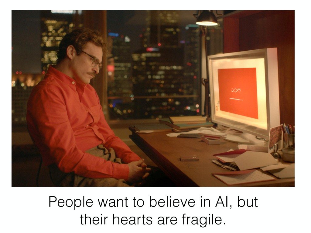 Theodor from the movie Her seated glumly in front of a computer screen, captioned "People want to believe in AI, but their hearts are fragile."