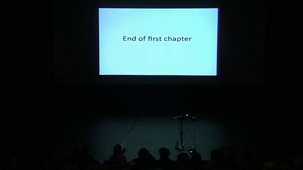 And empty stage, which Hito has just walked off, with a slide reading "End of first chapter"