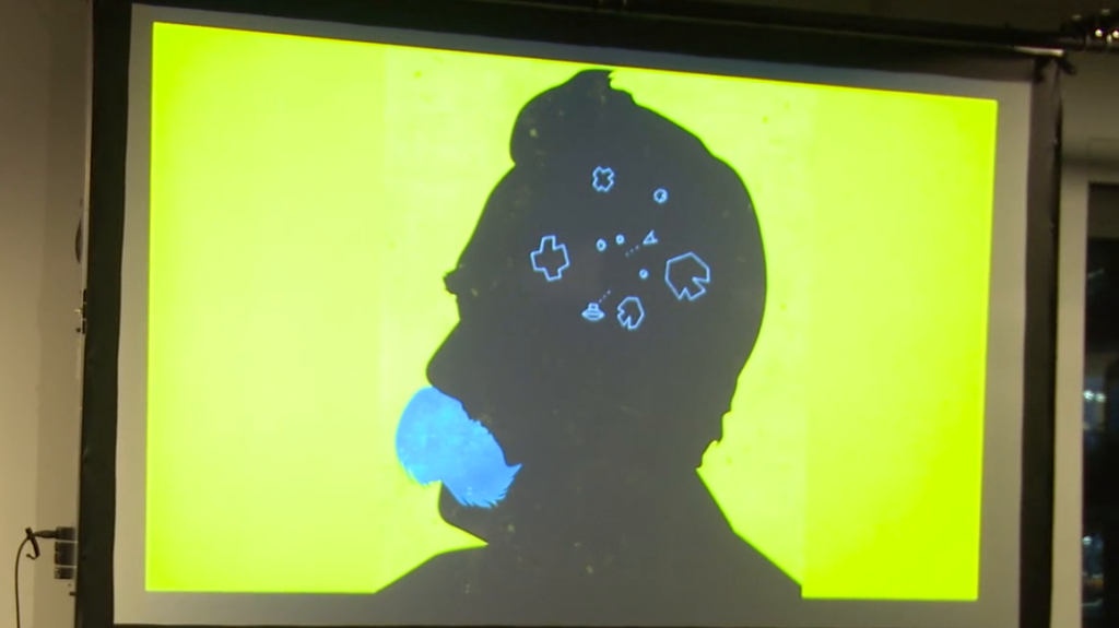 Silhouette of Friedrich Nietzche with graphics from the Asteroids video game visible in the brain region