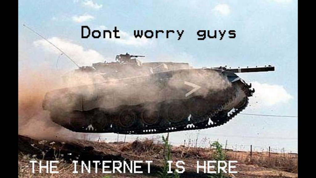 Photo of a tank airborne after clearing a hill, captioned "Don't worry guys, the Internet is here"