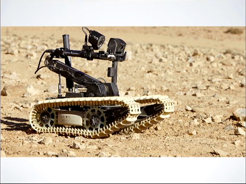 A small robot consisting of a set of tank-style treads and camera mounted on a movable arm