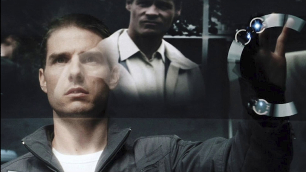 Tom Cruise's character in Minority Report, partially obscured by an augmented reality display of footage he is reviewing
