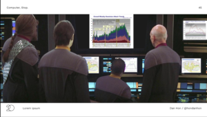 A previous image of several Enterprise officers looking at inscrutable reports on screen, with the reports replaced with mundane PowerPoint charts of "Overall Weekly Dominion Attack Trends" etc.