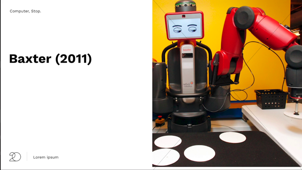 The Baxter robot, which primarily consists of two large red industrial robot arms, but also has a tablet-size screen above its main body showing line drawing-style eyes and eyebrows that indicate things like mood and the direction its looking