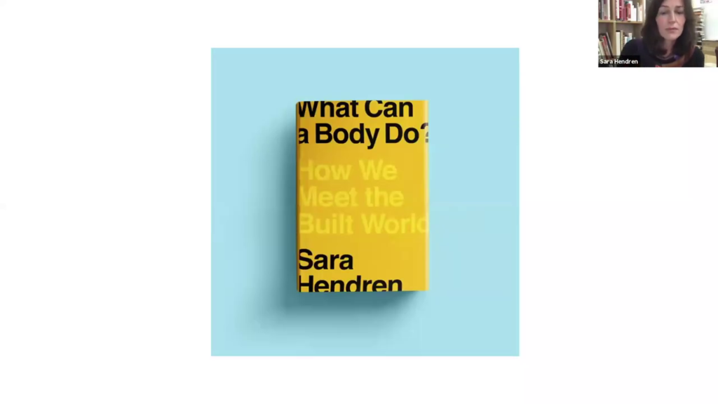 A copy of Sara's book on a blue surface. The cover is a bright yellow color, with the title, "What Can a Body Do? How We Meet the Built World" and her name both in very large type, composed so that they fall off the outer edges a bit
